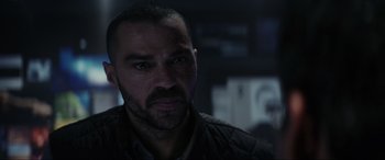 Movie still from “Secret Headquarters” (2022), directed by Henry Joost – A person with a beard; Close Up shot, Over the shoulder angle