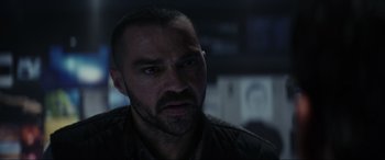 Movie still from “Secret Headquarters” (2022), directed by Henry Joost – A person looking at the camera; Close Up shot, Over the shoulder angle