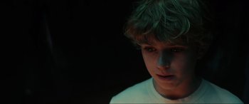 Movie still from “Secret Headquarters” (2022), directed by Henry Joost – A young boy is looking into the distance; Close Up shot, Low angle