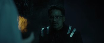 Movie still from “Secret Headquarters” (2022), directed by Henry Joost – A man with glasses is looking at the camera; Close Up shot, Over the shoulder angle