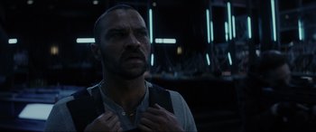 Movie still from “Secret Headquarters” (2022), directed by Henry Joost – A person holding his hands on his chest; Close Up shot, Over the shoulder angle