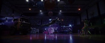 Movie still from “Secret Headquarters” (2022), directed by Henry Joost – A man flying through the air while riding an object; Extreme Wide shot, High angle