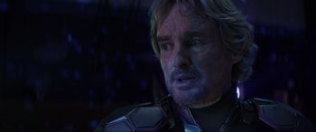 Movie still from “Secret Headquarters” (2022), directed by Henry Joost – A person wearing a suit; Close Up shot, Over the shoulder angle