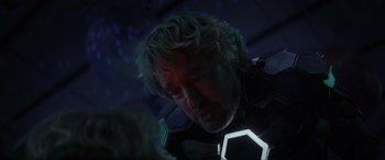 Movie still from “Secret Headquarters” (2022), directed by Henry Joost – A person wearing a suit; Close Up shot, Over the shoulder angle