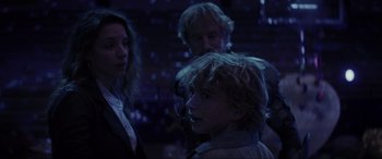Movie still from “Secret Headquarters” (2022), directed by Henry Joost – A group of people standing in a dark room; Medium shot, Over the shoulder angle