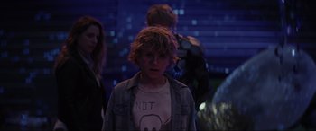 Movie still from “Secret Headquarters” (2022), directed by Henry Joost – A young boy is standing in front of a group of people; Close Up shot, Over the shoulder angle