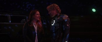 Movie still from “Secret Headquarters” (2022), directed by Henry Joost – A man and a woman standing next to each other; Medium shot, Over the shoulder angle