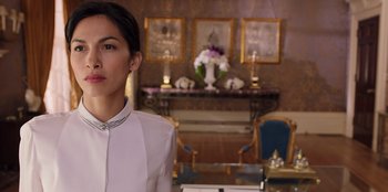 Movie still from “Secret Society of Second Born Royals” (2020), directed by Anna Mastro – A woman standing in front of a fireplace in a living room; Close Up shot, Over the shoulder angle