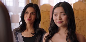 Movie still from “Secret Society of Second Born Royals” (2020), directed by Anna Mastro – Two young women posing for a picture in front of a mirror; Close Up shot, Over the shoulder angle