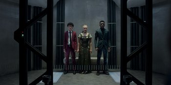 Movie still from “Secret Society of Second Born Royals” (2020), directed by Anna Mastro – A group of people standing next to each other in a room; Wide shot, Low angle