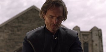 Movie still from “Secret Society of Second Born Royals” (2020), directed by Anna Mastro – A person with long hair wearing a jacket; Close Up shot, Low angle