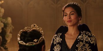 Movie still from “Secret Society of Second Born Royals” (2020), directed by Anna Mastro – A woman wearing a crown and a black robe; Close Up shot, Over the shoulder angle