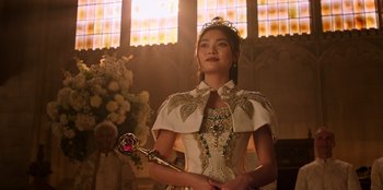 Movie still from “Secret Society of Second Born Royals” (2020), directed by Anna Mastro – A woman in a white dress holding a wand; Close Up shot, Low angle