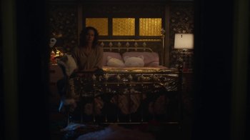 Movie still from “Euphoria” (2019), created by Sam Levinson – A woman sitting on a bed in front of a window; Wide shot, High angle