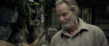 Movie still from “Blackthorn” (2011), directed by Mateo Gil – An older man with a long white beard; Close Up shot, Over the shoulder angle