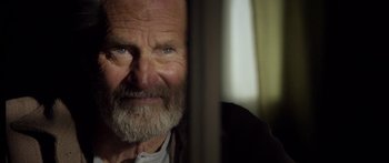 Movie still from “Blackthorn” (2011), directed by Mateo Gil – An old man with a beard looking at the camera; Close Up shot, Low angle