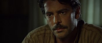 Movie still from “Blackthorn” (2011), directed by Mateo Gil – A person with a mustache; Close Up shot, Over the shoulder angle