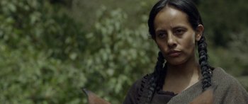 Movie still from “Blackthorn” (2011), directed by Mateo Gil – A woman with a bird in her hand; Close Up shot, Over the shoulder angle