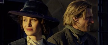 Movie still from “Blackthorn” (2011), directed by Mateo Gil – A woman and a man standing next to each other; Close Up shot, Low angle