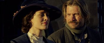 Movie still from “Blackthorn” (2011), directed by Mateo Gil – A man and a woman standing next to each other; Close Up shot, Low angle