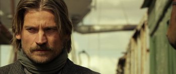 Movie still from “Blackthorn” (2011), directed by Mateo Gil – A person wearing a jacket; Close Up shot, Over the shoulder angle