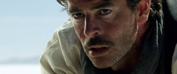 Movie still from “Blackthorn” (2011), directed by Mateo Gil – A man's face as he stares into the distance; Close Up shot, Low angle