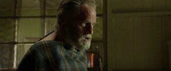 Movie still from “Blackthorn” (2011), directed by Mateo Gil – An old man with a beard is looking into the distance; Close Up shot, Low angle