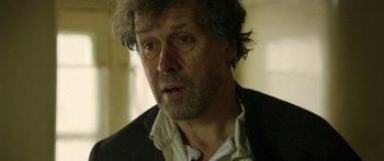 Movie still from “Blackthorn” (2011), directed by Mateo Gil – A person wearing a jacket; Close Up shot, Low angle