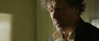 Movie still from “Blackthorn” (2011), directed by Mateo Gil – A person wearing a suit and tie; Close Up shot, Over the shoulder angle