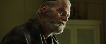 Movie still from “Blackthorn” (2011), directed by Mateo Gil – An old man with a beard and a gray beard; Close Up shot, Low angle