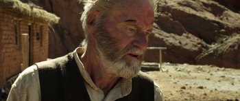 Movie still from “Blackthorn” (2011), directed by Mateo Gil – An old man with a beard and a white mustache; Close Up shot, Over the shoulder angle