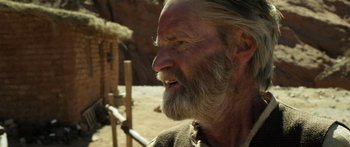 Movie still from “Blackthorn” (2011), directed by Mateo Gil – An old man with a long white beard; Close Up shot, Over the shoulder angle
