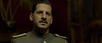 Movie still from “Blackthorn” (2011), directed by Mateo Gil – A person wearing a uniform; Close Up shot, Over the shoulder angle