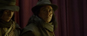 Movie still from “Blackthorn” (2011), directed by Mateo Gil – An old man with long hair wearing a hat; Close Up shot, Over the shoulder angle