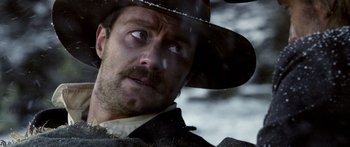 Movie still from “Blackthorn” (2011), directed by Mateo Gil – A person wearing a hat; Close Up shot, Over the shoulder angle