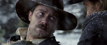 Movie still from “Blackthorn” (2011), directed by Mateo Gil – A person wearing a hat; Close Up shot, Over the shoulder angle