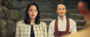 A man and a woman standing next to each other