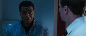 Movie still from “Serenity” (2005), directed by Joss Whedon – A man looking at himself in the mirror; Close Up shot, Over the shoulder angle