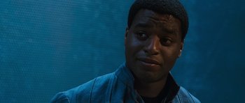 Movie still from “Serenity” (2005), directed by Joss Whedon – A person wearing a blue shirt; Close Up shot, Low angle