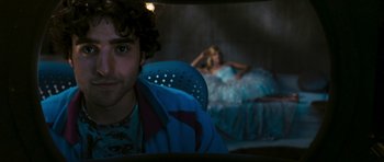Movie still from “Serenity” (2005), directed by Joss Whedon – A man sitting next to a woman on a bed in a room; Close Up shot, Over the shoulder angle