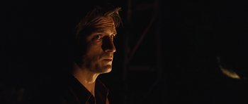 Movie still from “Serenity” (2005), directed by Joss Whedon – A person looking up at the sky; Close Up shot, Over the shoulder angle