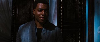 Movie still from “Serenity” (2005), directed by Joss Whedon – A young man is posing for a picture; Close Up shot, Over the shoulder angle