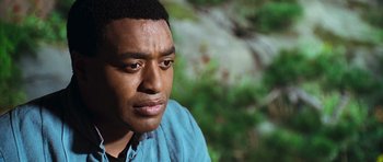 Movie still from “Serenity” (2005), directed by Joss Whedon – A person wearing a blue shirt; Close Up shot, Over the shoulder angle