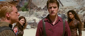 Movie still from “Serenity” (2005), directed by Joss Whedon – A man and a woman standing next to each other; Medium shot, Over the shoulder angle