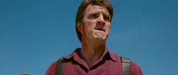 Movie still from “Serenity” (2005), directed by Joss Whedon – A person wearing a red shirt; Close Up shot, Low angle