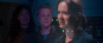 Movie still from “Serenity” (2005), directed by Joss Whedon – A man and a woman looking at the camera through a window; Close Up shot, Over the shoulder angle