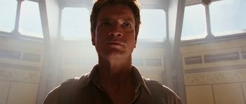Movie still from “Serenity” (2005), directed by Joss Whedon – A person wearing a brown shirt; Close Up shot, Low angle