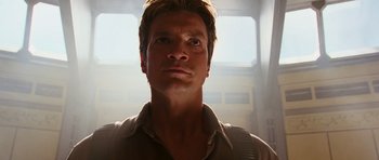 Movie still from “Serenity” (2005), directed by Joss Whedon – A person looking at the camera; Close Up shot, Low angle