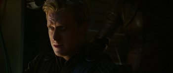 Movie still from “Serenity” (2005), directed by Joss Whedon – A person wearing a black jacket; Close Up shot, Over the shoulder angle