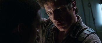 Movie still from “Serenity” (2005), directed by Joss Whedon – A person with a nose ring; Close Up shot, Over the shoulder angle